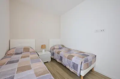 Letto o letti in una camera di East Side Apartments