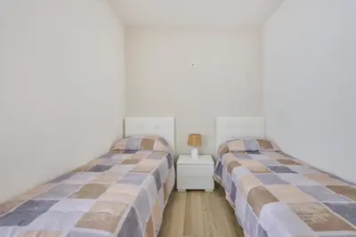 Letto o letti in una camera di East Side Apartments