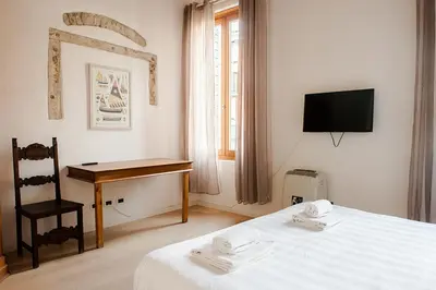 Letto o letti in una camera di Allo Squero Apartment