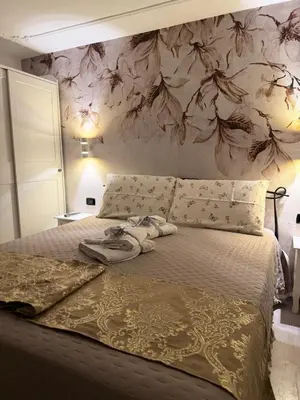 Letto o letti in una camera di Palazzo Carignano
