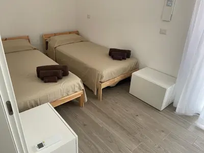 Letto o letti in una camera di Le Village Tropezien