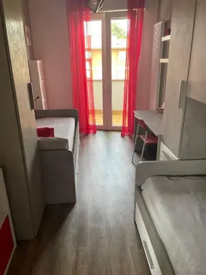Letto o letti in una camera di Casa Dada