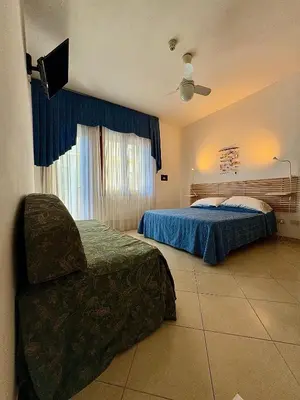 Letto o letti in una camera di Hotel Fortuna