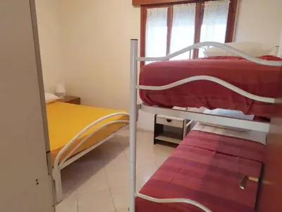 Letto o letti in una camera di Apartment in Rosolina Mare 25004