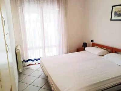 Letto o letti in una camera di Apartments in Rosolina Mare 24930