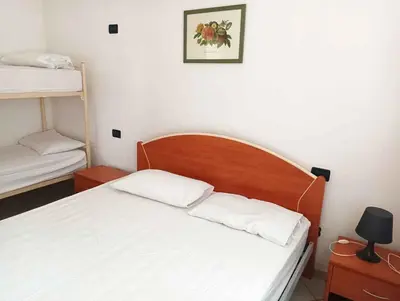 Letto o letti in una camera di Apartments in Rosolina Mare 24930