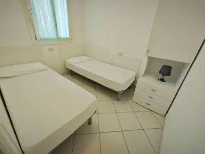 Letto o letti in una camera di Holiday Homes in Rosolina Mare 25014