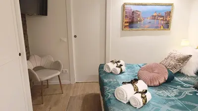 Letto o letti in una camera di Cupido Suite by Ca-Sa Check