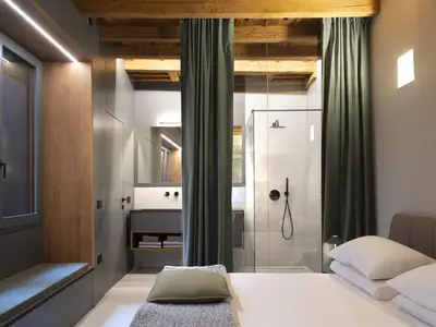 Letto o letti in una camera di Officine Cavour CASA DEI LEONI Centro Storico Padova