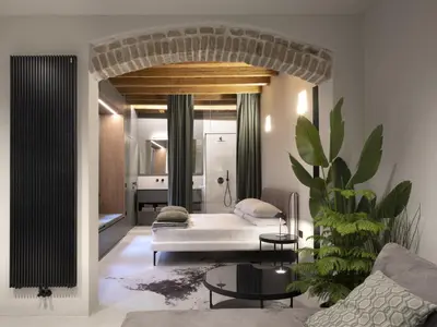Letto o letti in una camera di Officine Cavour CASA DEI LEONI Centro Storico Padova
