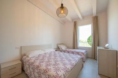 Letto o letti in una camera di Wave Island Torre B23