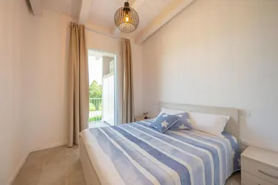 Letto o letti in una camera di Wave Island Torre B23