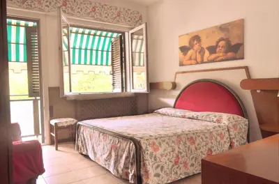 Letto o letti in una camera di Hotel Roma
