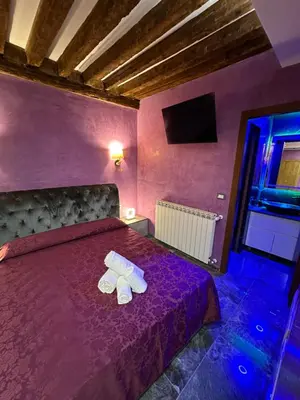 Letto o letti in una camera di Venice Rainbow Apartments BIENNALE