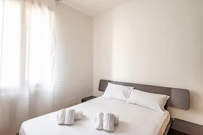 Letto o letti in una camera di GuestHost - Padova Suite Isabella 500 meters from the Duomo!