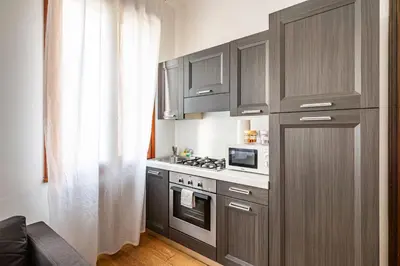 Cucina o angolo cottura di GuestHost - Padova Suite Isabella 500 meters from the Duomo!