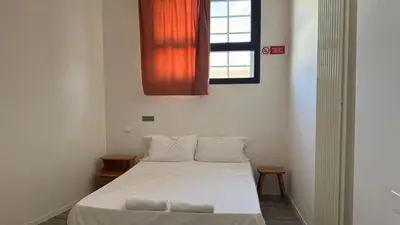 Letto o letti in una camera di Ostello di Vicenza