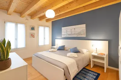 Letto o letti in una camera di Ca' Degli Antichi Giardini Apartments