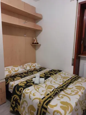 Letto o letti in una camera di Punto FM