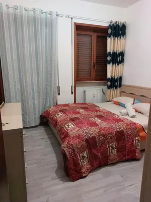 Letto o letti in una camera di Punto FM