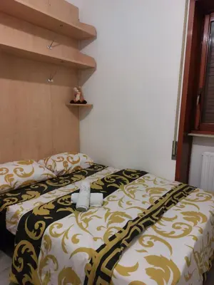 Letto o letti in una camera di Punto FM