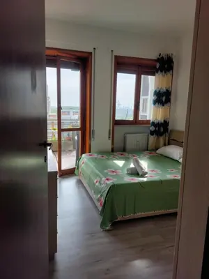 Letto o letti in una camera di Punto FM