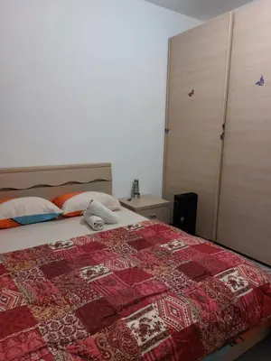 Letto o letti in una camera di Punto FM