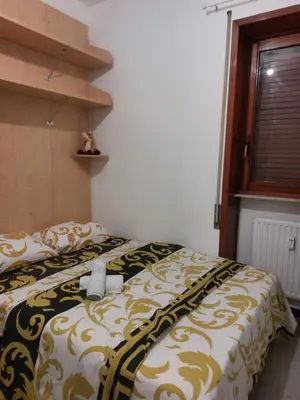 Letto o letti in una camera di Punto FM