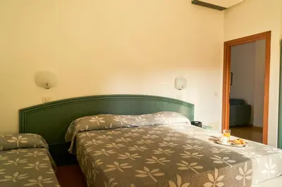 Letto o letti in una camera di Aparthotel La Pineta