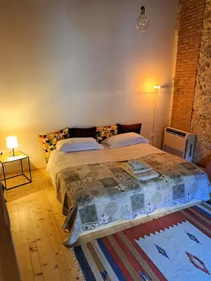 Letto o letti in una camera di Appartamento con Spa Privata e vista falesia - La Perla a Lumignano