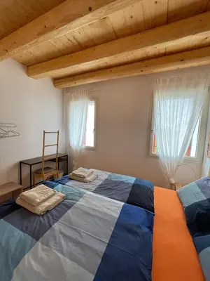 Letto o letti in una camera di Casa Italia locazione turistica