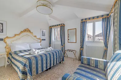 Letto o letti in una camera di Ca'Paradiso