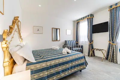 Letto o letti in una camera di Ca'Paradiso