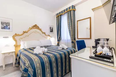 Letto o letti in una camera di Ca'Paradiso