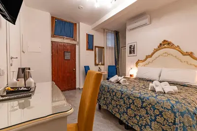 Letto o letti in una camera di Ca'Paradiso