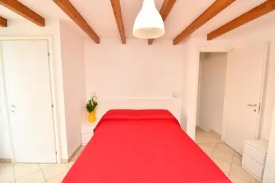 Letto o letti in una camera di Appartamenti Arcobaleno