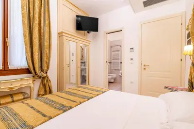 Letto o letti in una camera di Casa Marsilli