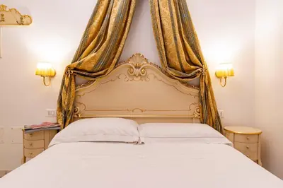 Letto o letti in una camera di Casa Marsilli