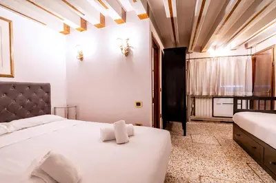 Letto o letti in una camera di Ca' di Loto