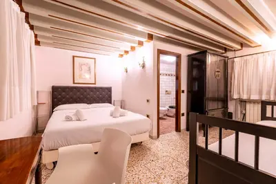 Letto o letti in una camera di Ca' di Loto