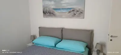 Letto o letti in una camera di Villa AdeMar Nel cuore di Jesolo