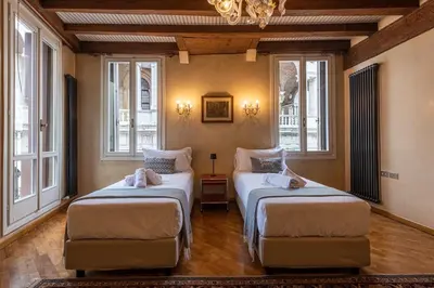 Letto o letti in una camera di Il Palazzo della Basilica