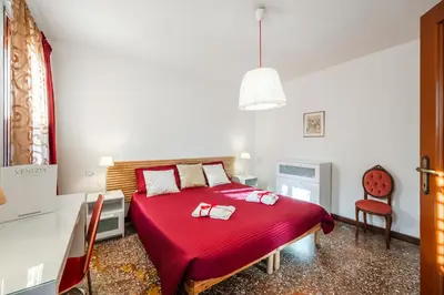 Letto o letti in una camera di QUEEN HOME Carlotta