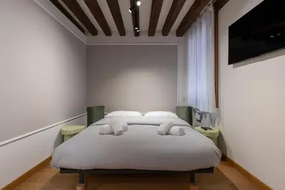 Letto o letti in una camera di Cavalletto Suite