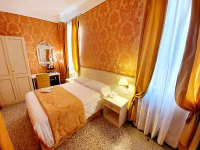 Letto o letti in una camera di Hotel Corte dei Greci
