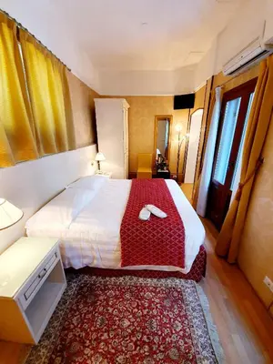 Letto o letti in una camera di Hotel Corte dei Greci
