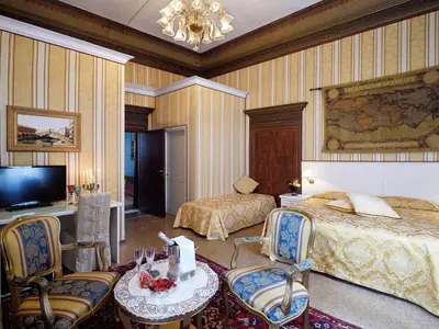 Letto o letti in una camera di Hotel Corte dei Greci