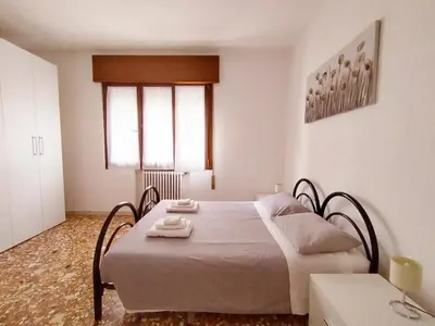 Letto o letti in una camera di Ca' Vivaldi Appartamento Mestre