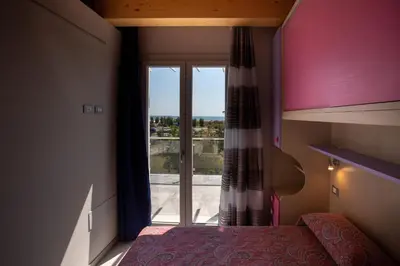 Letto o letti in una camera di Elsa Attico vista mare