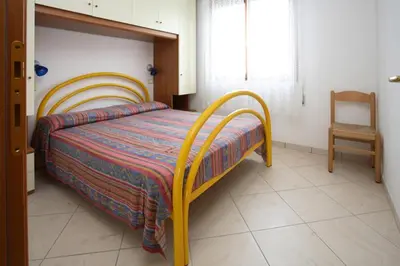 Letto o letti in una camera di Elsa 2 camere da letto vista spiaggia